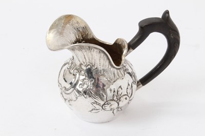 Lot 410 - A continental silver cream jug with ebony handle