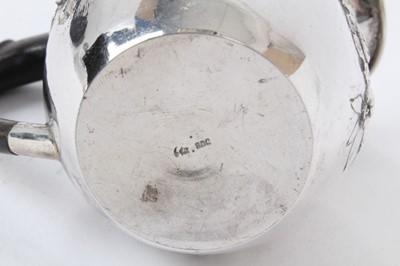 Lot 156 - A continental silver cream jug with ebony handle