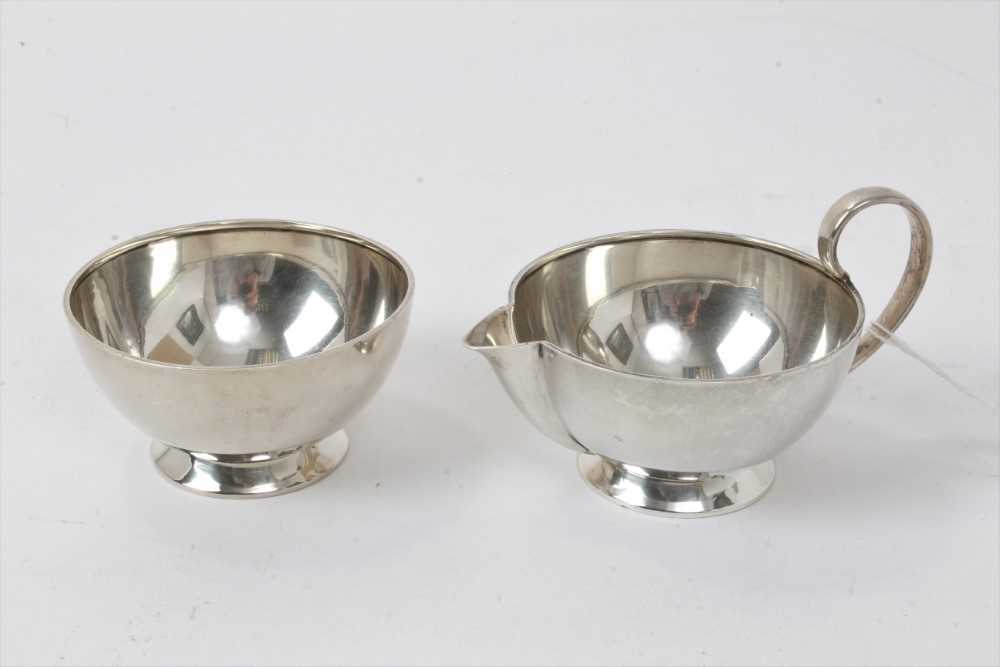 Lot 157 - 1940's matching silver cream jug and bowl in the Christopher Dresser style