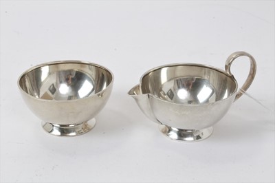Lot 411 - 1940's matching silver cream jug and bowl in the Christopher Dresser style