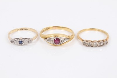 Lot 705 - Three Edwardian diamond and gem-set rings to include a ruby and diamond crossover ring in platinum setting on 18ct yellow gold shank, diamond five stone ring in platinum setting on 18ct gold shank,...