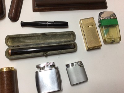 Lot 2425 - Group of smoking paraphernalia, including a Dunhill lighter, gold mounted cheroot holder, leather cigar case, etc