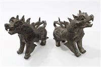 Lot 635 - Pair of Eastern bronze figures of mythical...