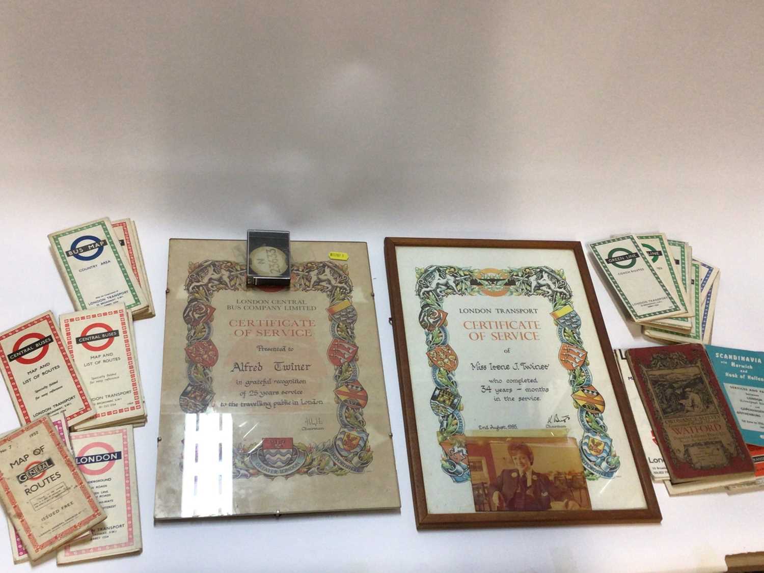 Lot 2480 - Two framed London Central Bus Company Certificates of Services, together with staff badge and a collection of old London bus and train maps
