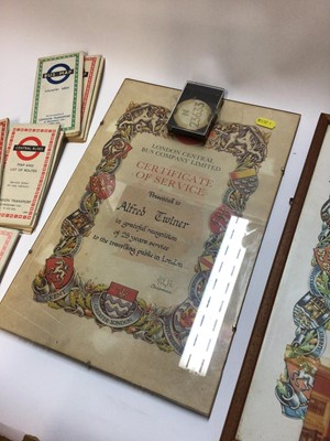 Lot 2480 - Two framed London Central Bus Company Certificates of Services, together with staff badge and a collection of old London bus and train maps
