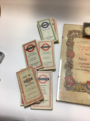 Lot 2480 - Two framed London Central Bus Company Certificates of Services, together with staff badge and a collection of old London bus and train maps