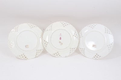 Lot 237 - Set of three Minton plates with pierced borders and polychrome painted with floral sprays