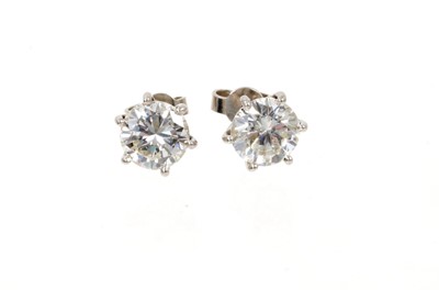 Lot 633 - Pair of diamond single stone earrings
