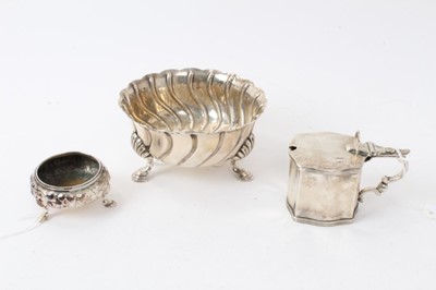 Lot 465 - George V silver sugar bowl of circular form with spiral decoration on three hoof feet (London 1911) Garrard & Co, together with a George V