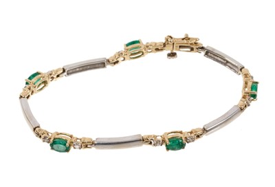 Lot 787 - Emerald and diamond bracelet in 14K white and yellow gold setting