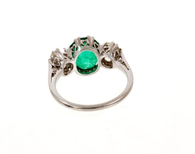 Lot 625 - Emerald and diamond three stone ring