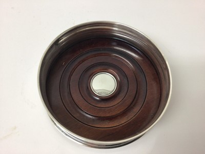 Lot 165 - Contemporary silver wine coaster with turned wooden base