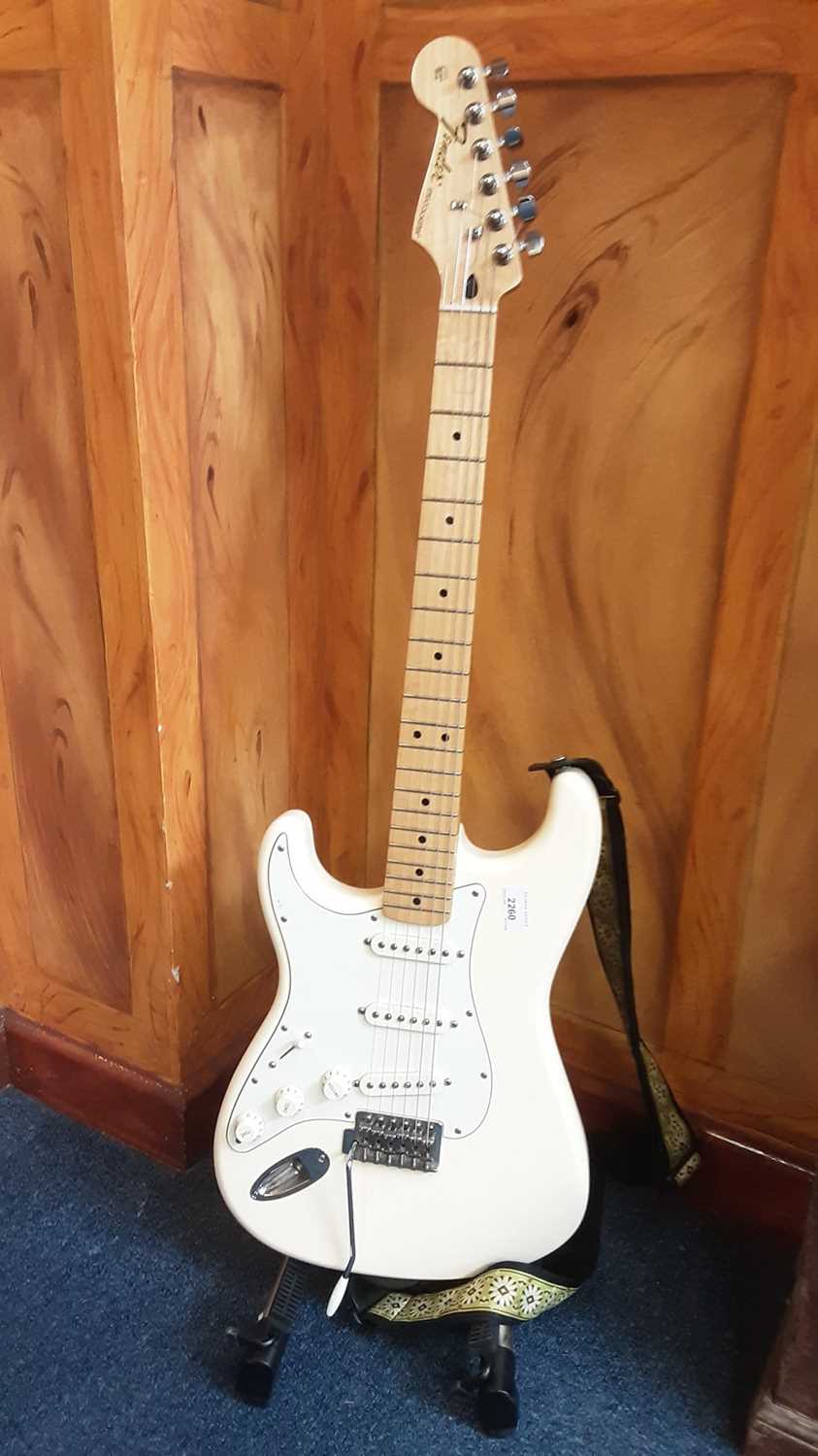 Lot 2260 - Fender Stratocaster left-handed electric six string guitar, official contour body in white/cream , model number 15636022 , made in Mexico. 
£250/350