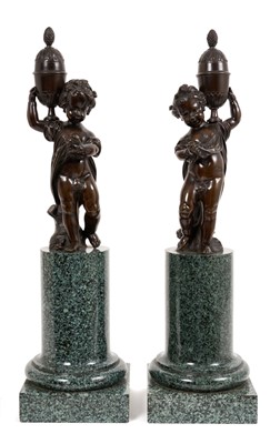 Lot 942 - Pair of Classical revival putti figures on marble pedestals