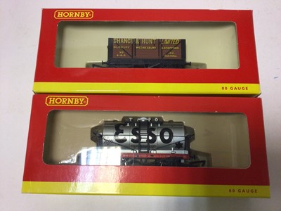 Lot 246 - Hornby OO gauge rolling stock including BR Carflat Car Transporter (x5), R6143, EWS closed van (x3), R6042A, BR Bogie Bolster A (x4), R6123, plus nine other wagons, all boxed (22)
