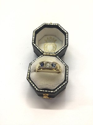 Lot 1015 - Sapphire and diamond three stone ring