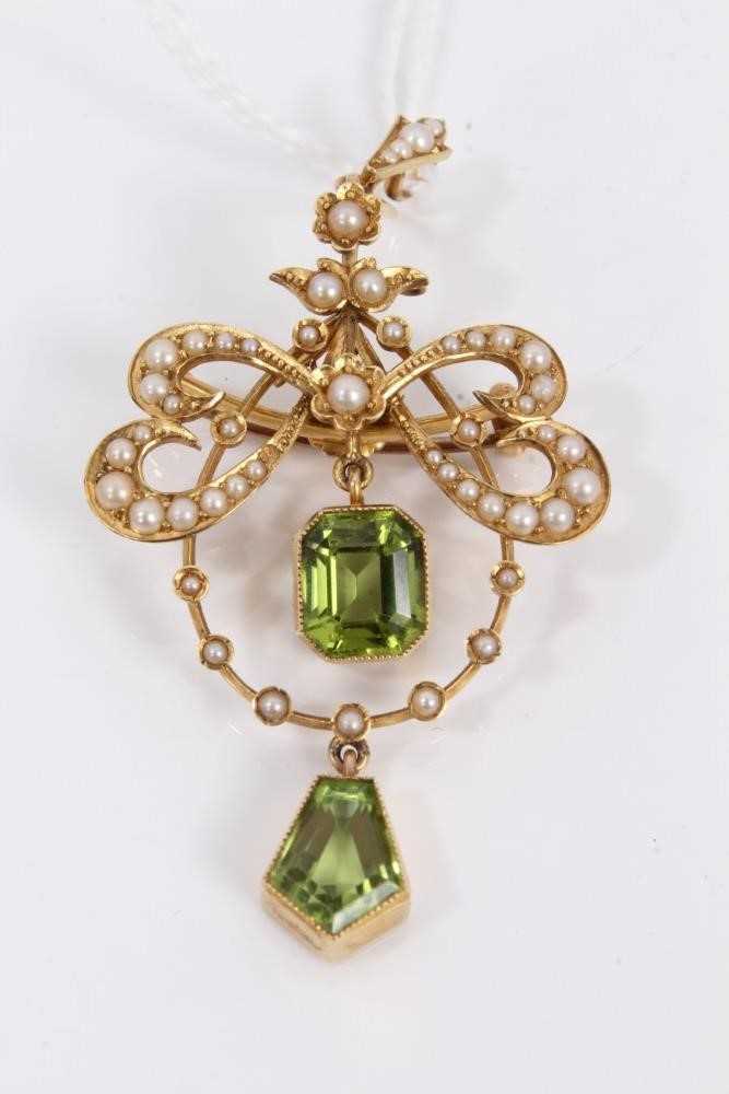 Lot 69 - Edwardian 15ct gold peridot and seed pearl open work brooch/pendant