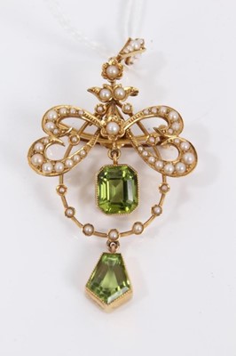 Lot 69 - Edwardian 15ct gold peridot and seed pearl open work brooch/pendant