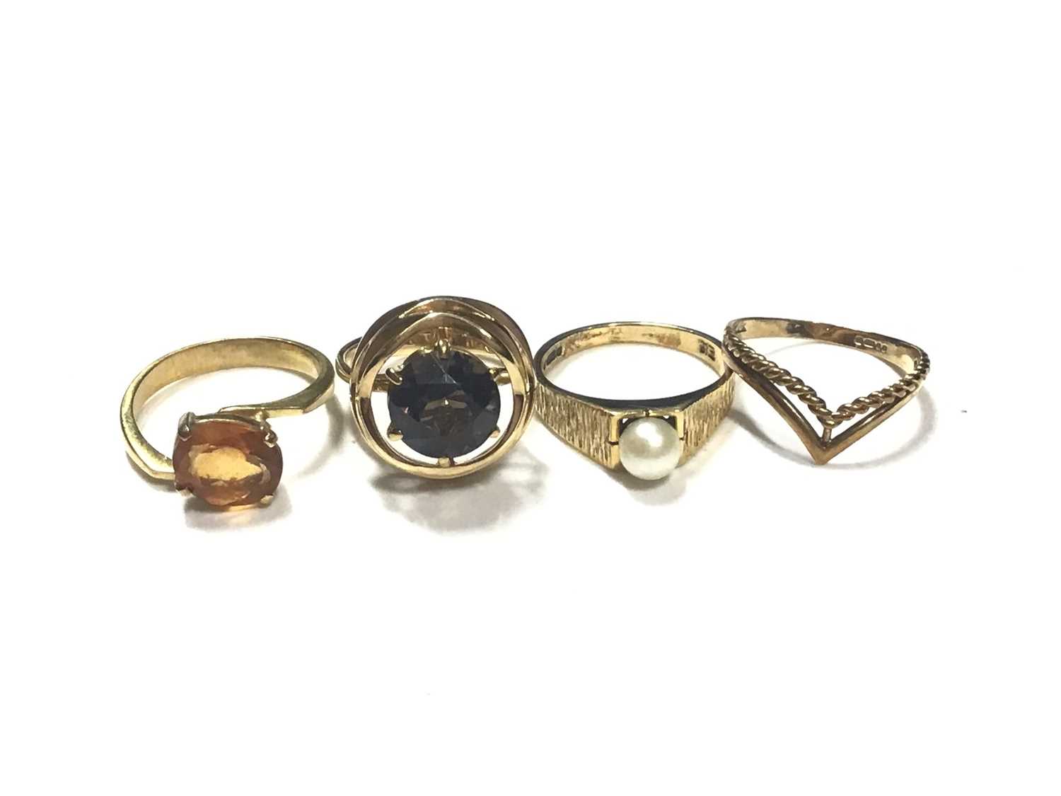 Lot 4 - Two 18ct gold gem set dress rings, 9ct gold cultured pearl ring and 9ct gold wishbone ring (4)