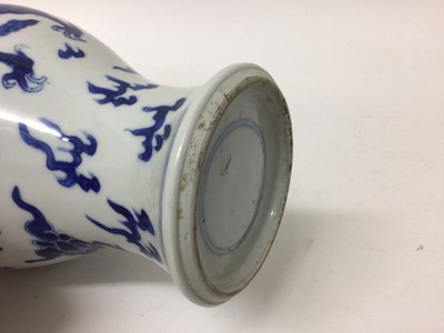 Lot 202 - 19th century Chinese porcelain blue and white baluster shape vase with a carved wooden cover