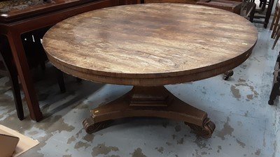 Lot 1223 - Regency rosewood circular breakfast table with tilt top on pedestal with trefoil plateau base and scroll feet.