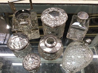 Lot 1039 - Edwardian and later silver topped glass bottles and others (7)