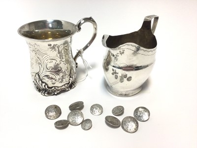 Lot 205 - Georgian silver cream jug, Victorian silver christening mug and a ten continental  silver buttons