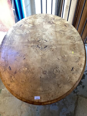 Lot 1224 - Late Victorian marquetry inlaid burr walnut veneered oval table with tilt top on pedestal base