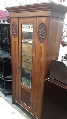 Lot 1216 - Edwardian oak single wardrobe with mirrored door and carved panels