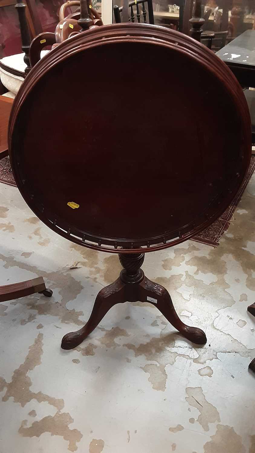 Lot 1205 - Mahogany tilt top wine table with gallery decoartion