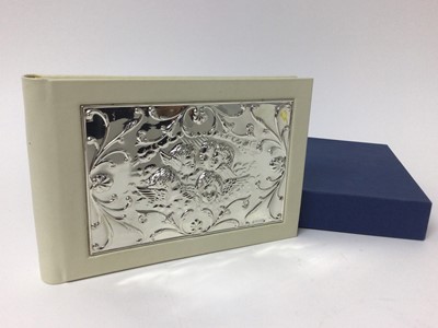 Lot 115 - Carrs silver fronted photos album, decorated with winged cherubs - boxed