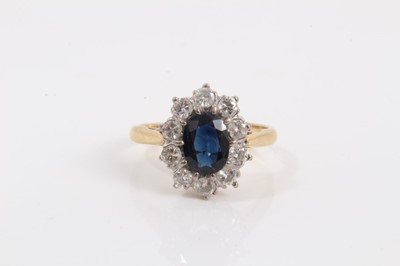 Lot 778 - Sapphire and diamond cluster ring