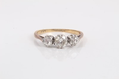 Lot 780 - 18ct gold diamond three stone ring in platinum setting