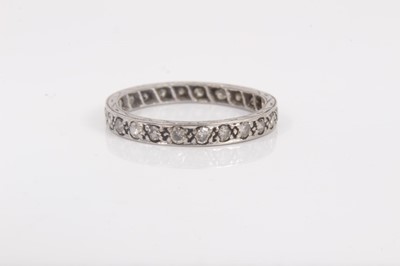 Lot 781 - Diamond eternity ring with a full band of twenty four brilliant cut diamonds