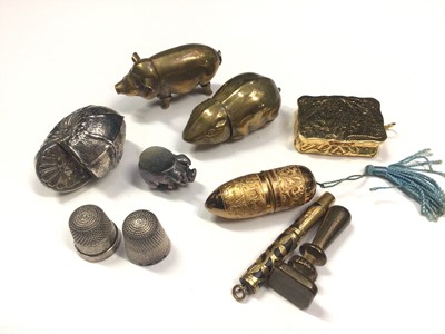 Lot 13 - Miniature silver pig pin cushion, 25mm, brass pig and brass mouse vestas, white metal shell box, two silver thimbles, gilt metal thimble case, gilt metal vinaigrette and other items