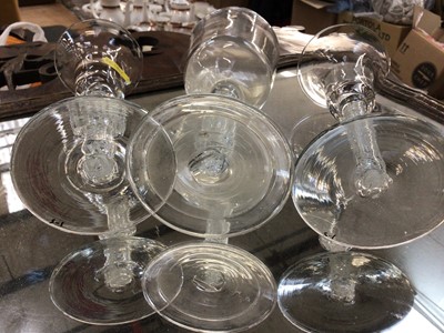 Lot 111 - Pair of antique wine glasses with opaque air twist stems and a Georgian wine glass with bucket shape bowl and air twist stem on folded foot (3)