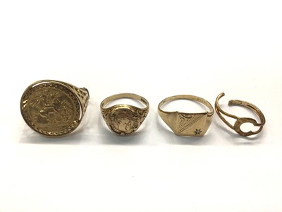 Lot 1031 - Four 9ct gold rings to include St. George medal ring, coin ring, signet ring and an initial ring (broken)