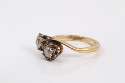 Lot 60 - 18ct gold diamond two stone cross over ring with two old cut diamonds
