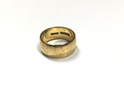 Lot 61 - 1960s 22ct gold wide band wedding ring with engraved leaf decoration