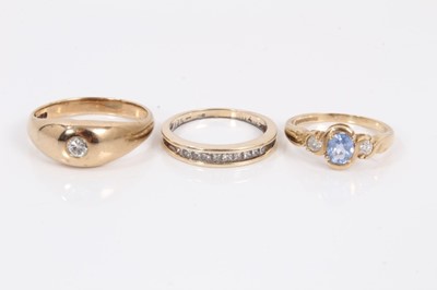 Lot 62 - 9ct gold diamond half eternity ring, 9ct gold diamond and blue stone ring and 9ct gold ring set with a single stone diamond in rub over setting (3)