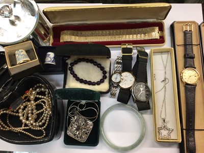 Lot 1043 - Costume jewellery to include a silver pendant on chain, four wristwatches and bijouterie