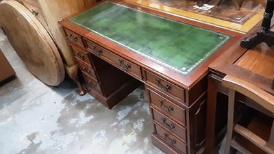 Lot 1219 - Reproduction mahogany twin pedestal desk with inset leather lined top and nine drawers below, 121cm wide, 51cm deep, 77.5cm high