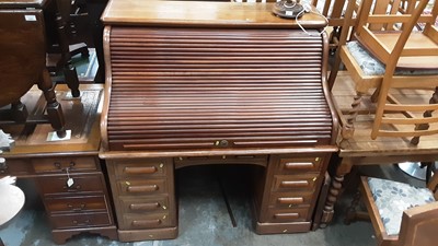 Lot 1228 - Good quality early 20th century oak and beech roll top desk with fitted interior enclosed by tambour shutter with nine drawers below, retailed by Maple & Co, London & Paris, 127cm wide, 86cm deep,...