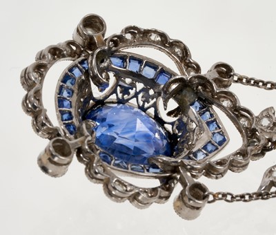 Lot 620 - Fine early 20th century Belle Époque sapphire and diamond necklace, the principal oval mixed cut cornflower blue sapphire estimated to weigh approximately 8.40 carats, in millegrain collet setting...