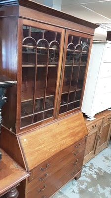 Lot 1248 - Edwardian mahogany bureau bookcase with shelves above enclosed by two glazed doors, fitted interior and four drawers below, 111cm wide, 48cm deep, 205cm high