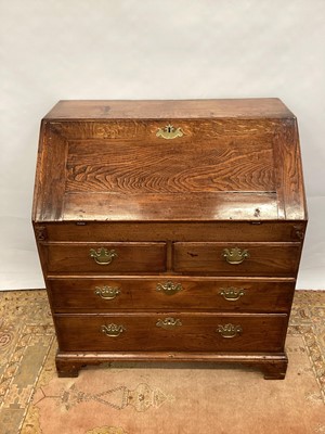 Lot 1510 - George II honey oak bureau.