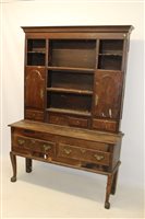 Lot 1119 - 18th century oak high dresser, the boarded...