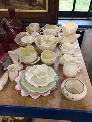 Lot 69 - Collection of Belleek, together with a group of cranberry glass and four Doulton character jugs
