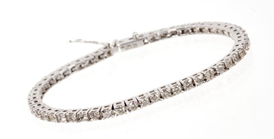 Lot 662 - Diamond tennis bracelet with a line of fifty three brilliant cut diamonds