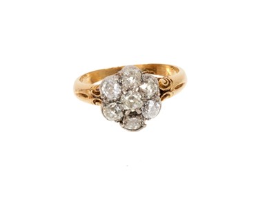 Lot 665 - Victorian diamond cluster ring with a flower head cluster of seven old cut diamonds